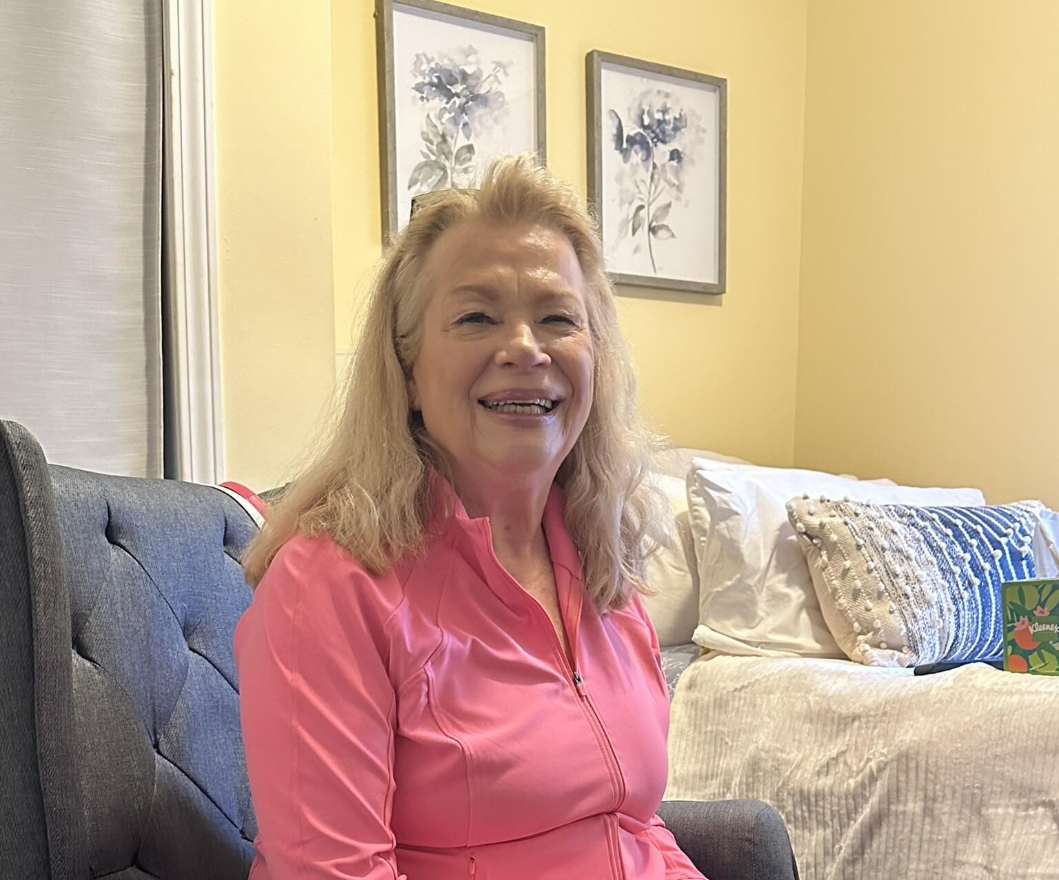 senior woman in peach shirt