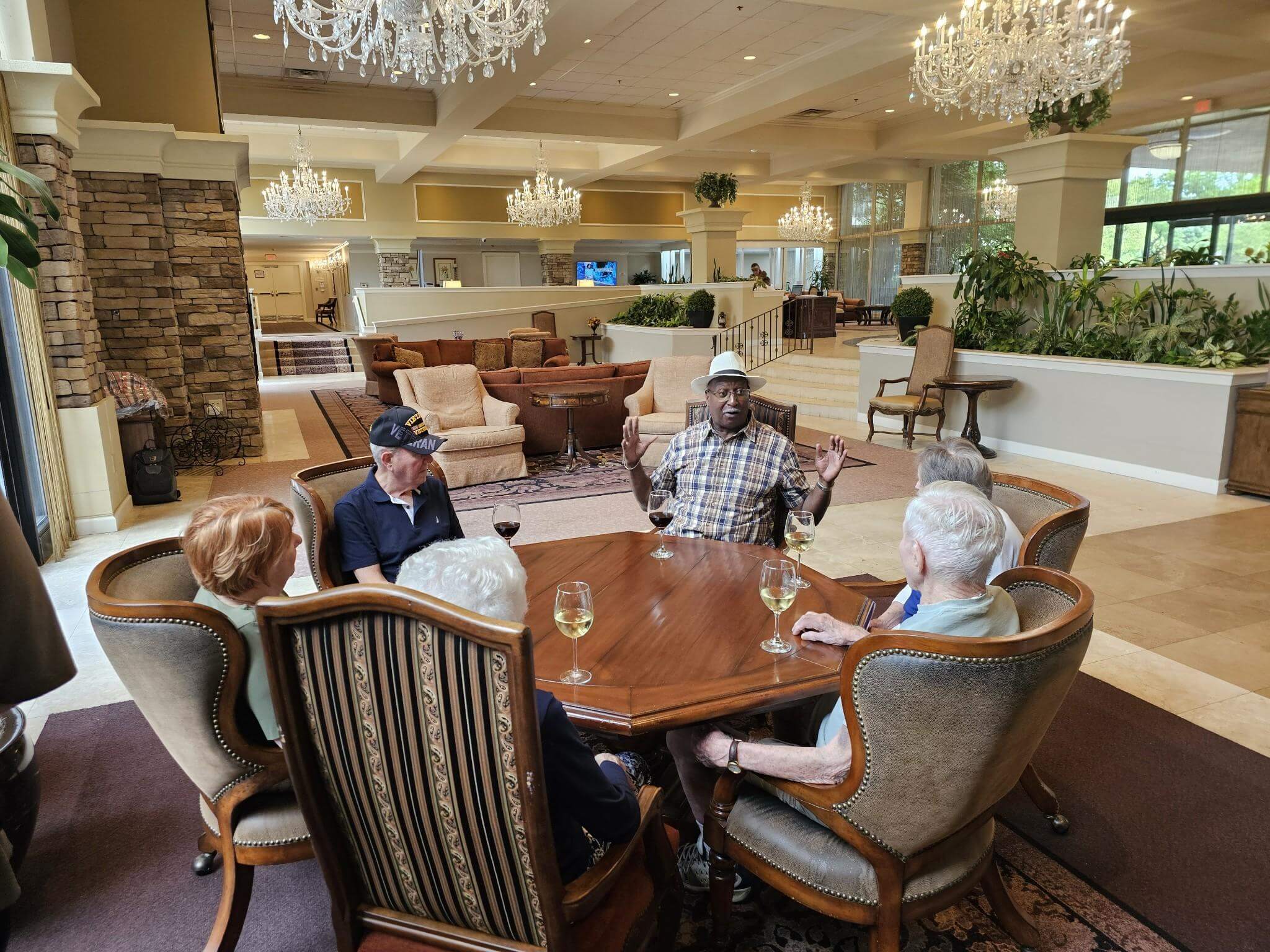 Residents around the table having happy hour