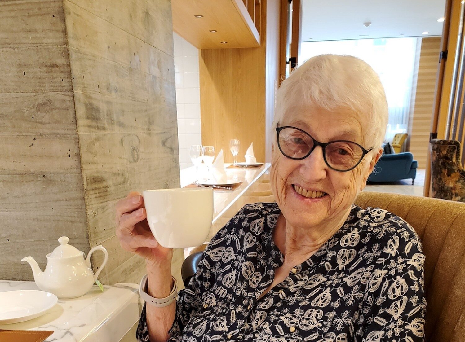 Senior smiling with cup of coffee