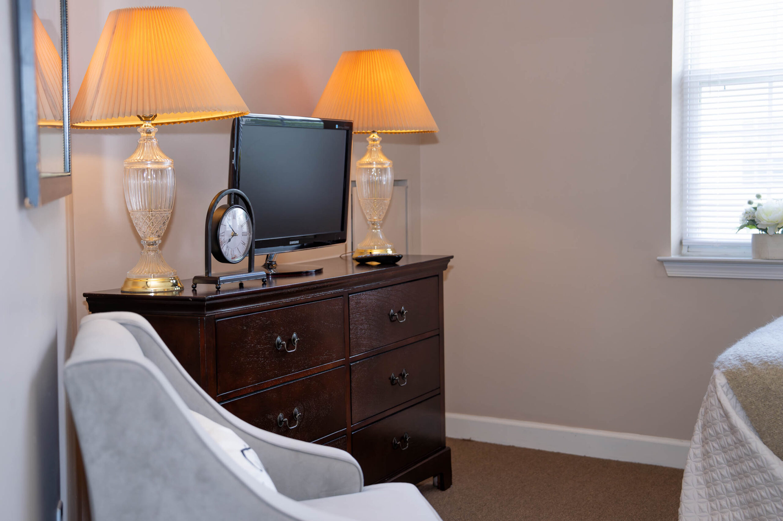 armoire with tv and sitting chair