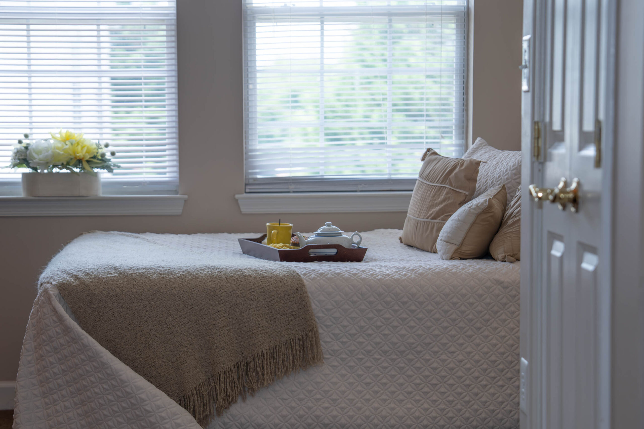 bed with window in the background